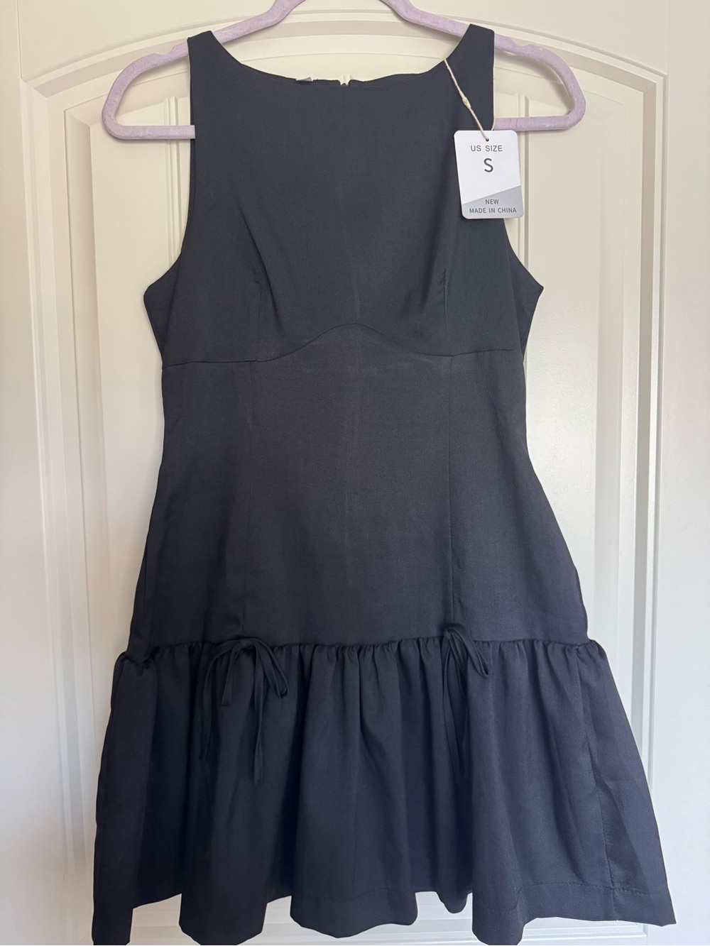 Amazon Black Sleeveless Mini Dress with Ruffle Hem